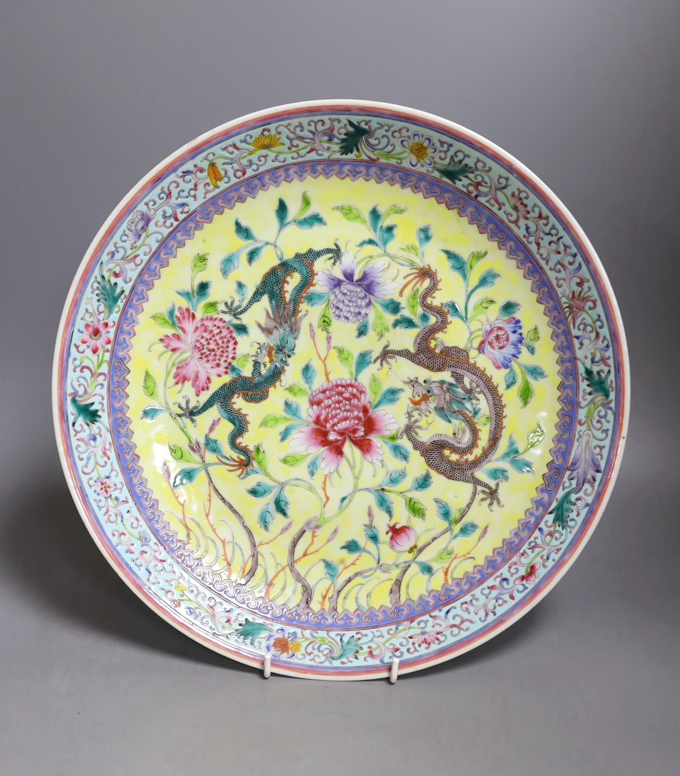 A Chinese yellow ground ‘dragon’ dish, Qianlong mark but Republic period, 34 cms diameter.